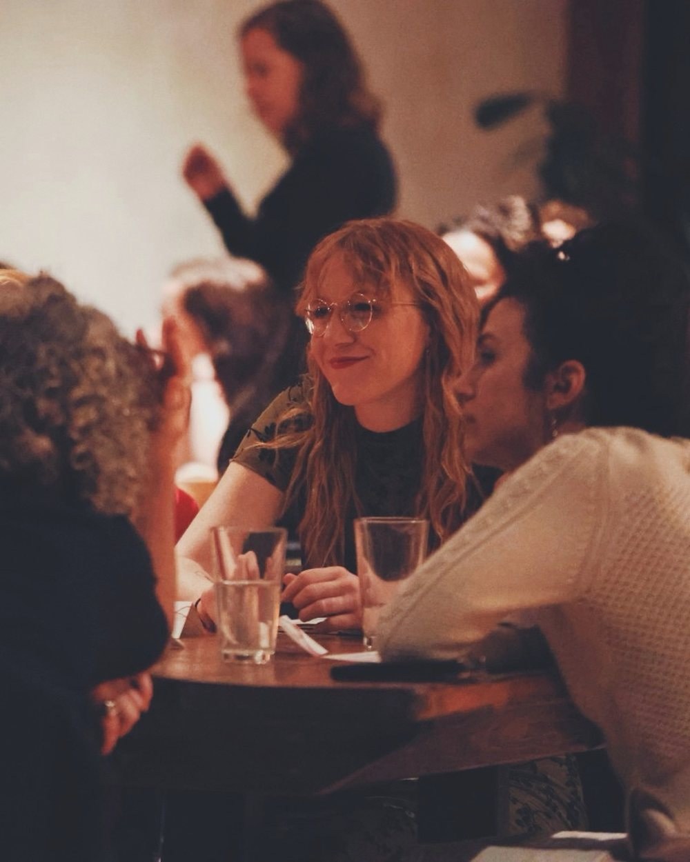 The table full, late in the evening at a women's gathering on The Land